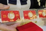 Tối 1-5, giá vàng thế giới đột ngột giảm nhanh